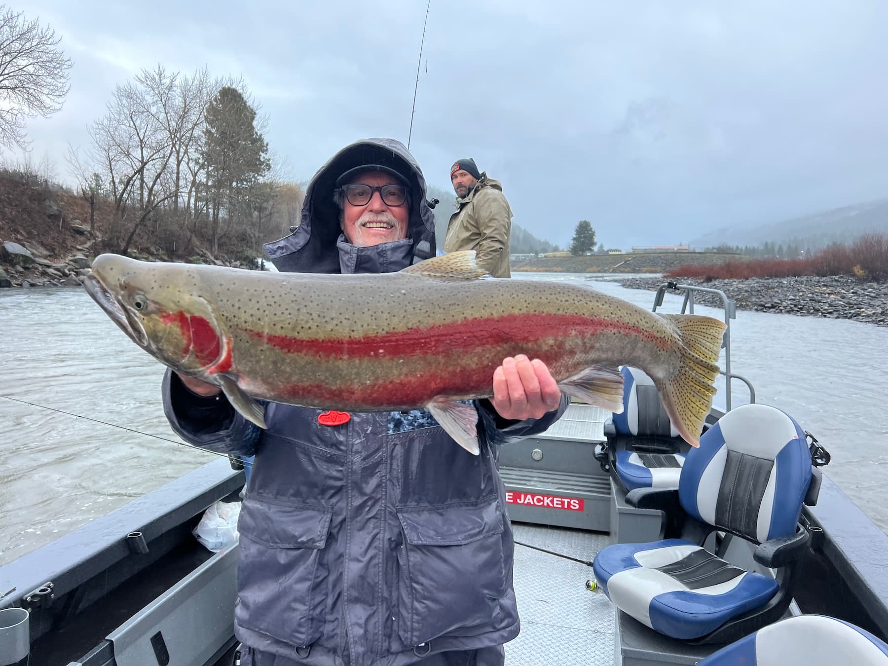 Angler holding steelhead